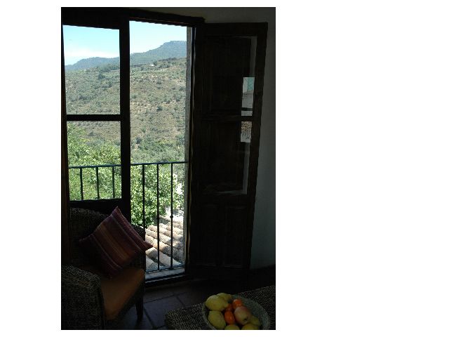Enjoy the stunning backdrop of the Rio Santo gorge while eating breakfast in the sunny dining area
