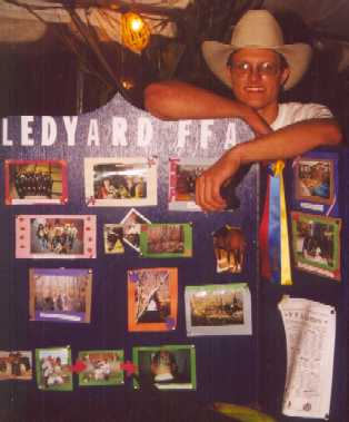 Jerry Blankenbaker, Class of 2002, with the FFA display at the 2000-01 Ledyard Fair Poultry Booth