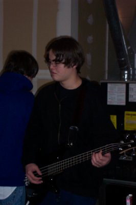Chris... frowning? Making a face? We're not sure.