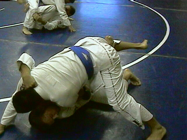 Attempting Hook Sweep to the right, opponent posts with left foot