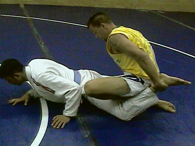 Drop your weight over one of his legs as your climb his back
