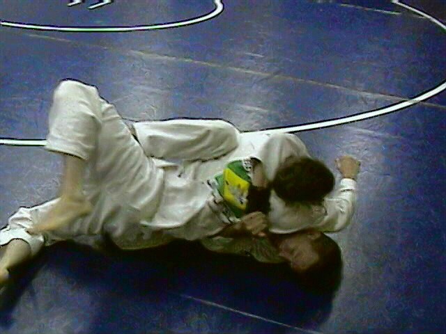 Hook sweep to the side of his trapped arm