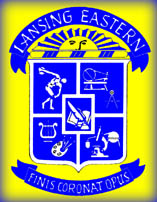 The Eastern High School Seal: A banner at the top declares, "Lansing Eastern High School."  At the bottom a second banner bears the school motto, "Finis Coronat Opus."  In the center, a shield bears devices symbolizing athletics, practical skills, the arts, and science surrounding a fifth device symbolizing language arts.