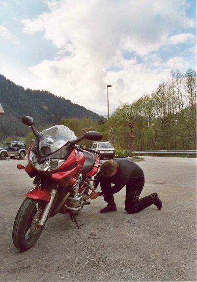 Mark doing some wrenching on his bike.