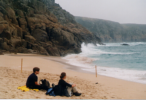 watching the waves crashing against the rocks