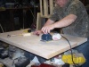 Sanding down the plugs bringing them flush