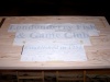 The transposing template attached to the sign blank, carbon side down.