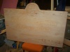 The top of the roundell is fashioned and shaped to the sign.