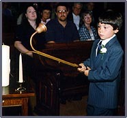 Jeremy lighting candles prior to start of ceremony