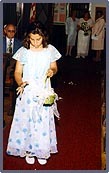 Simone dropping rose petals down the aisle