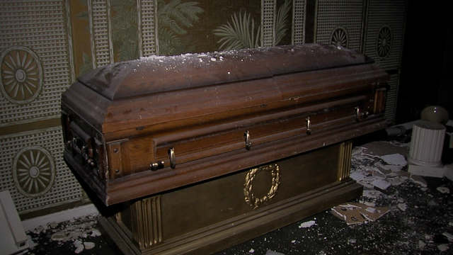 The abandoned funeral home in Ohio: beside the cemetery there is an abandoned funeral home where many candles are seen burning often at late night.