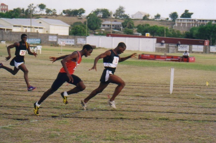 Tonito Willett of Nevis nips Antiguan athlete in winning the 100m Gold at 2001 Juniors, and Map of the Eastern Caribbean, showing the member islands of the Leeward Islands Athletic Association
