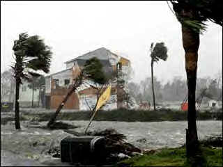   "Construction material from a Pensacola, FL; home being renovated in the wake of Hurricane Ivan blows in the breeze after being struck by Hurricane Katrina."  (hur-katrina03.jpg,11 KB)  �