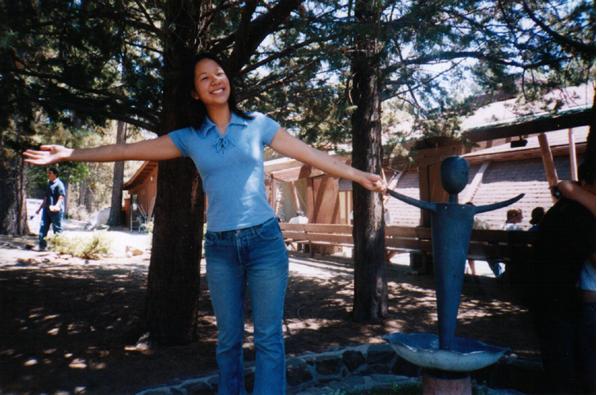 Christine and the weird person statue in front of the auditorium