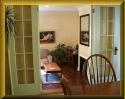 The dining room leads to the living room/sun room.  Click to see a larger image.