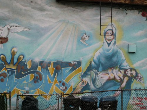 Bushwick neighborhood graffiti featuring Pieta imagery