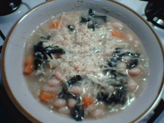 white bean and greens soup, with a hard cheese grated over the top