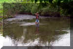 Frank catching a brown trout in Sharon Center