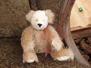 Delight is a 14" bent leg bear, fully jointed and made of two tones of sparse mohair. He has ultrasuede paws and is stuffed with pellets and polyfill. Adoption fee: $125 US dollars