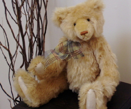 Henry is a sweet 17" golden mohair bear. His paws are of wool felt and he is stuffed with pellets and polyfill which gives him a wonderful huggabilty! Adoption fee: $150 US dollars