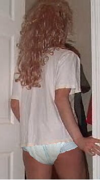 [A picture of a female in a t-shirt and a diaper]