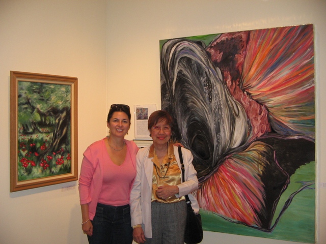Irina Selya, MD -- with her "Poppies"  and the artist's "Mt. Pinatubo"