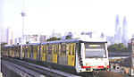 A Star trainset running along an elevated section of the Kuala Lumpur metro network.