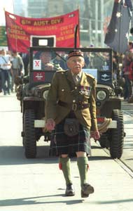MajKeithWalker-85-marching-2km-anzac2003
