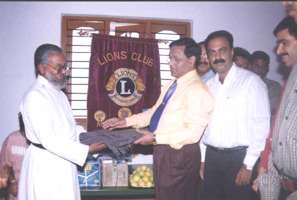 donating blanlets and fans and food to old age home