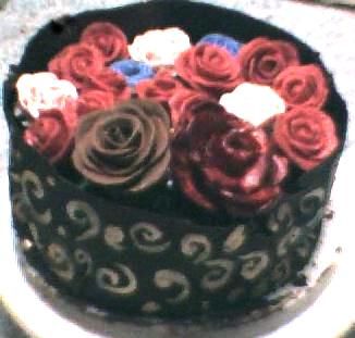 Boston Cream pie disguised as a wrap of roses.