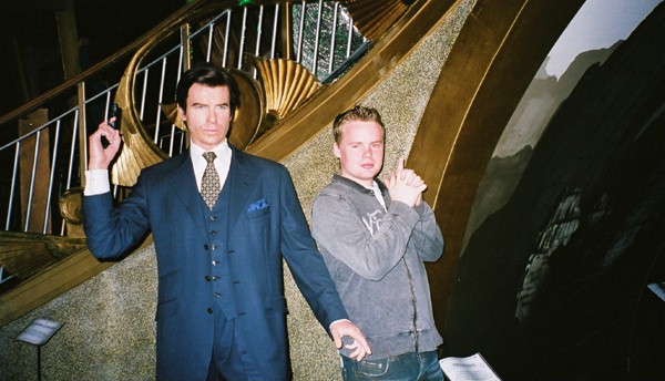 Chris (attempting to impersonate) James Bond (Pierce Brosnan)