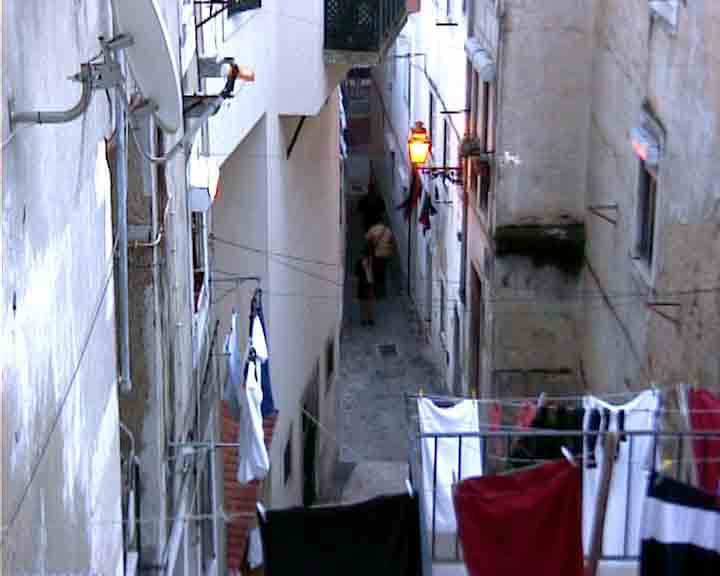 Portugal photos - The white-washed houses bring brightness to Lisbon by night