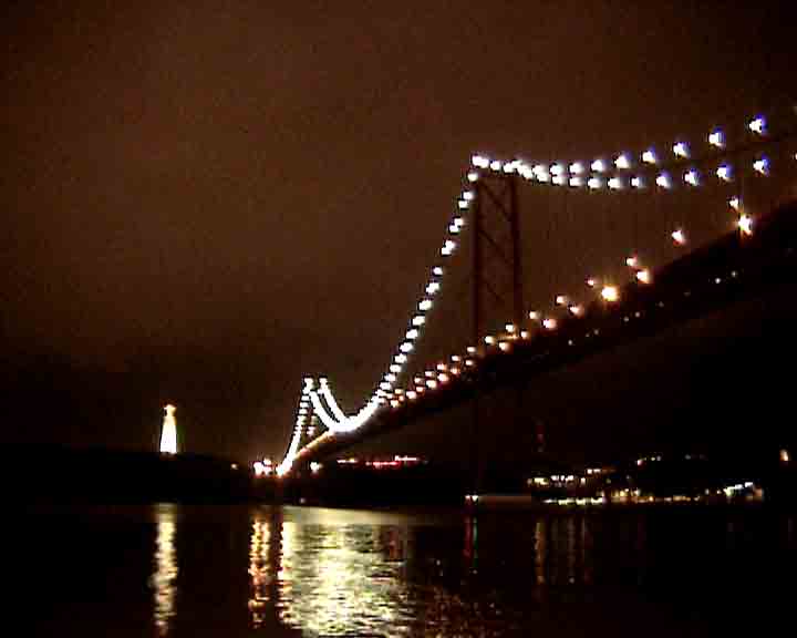 Lisbon dvd video - Christ near 25 April bridge, by night.
