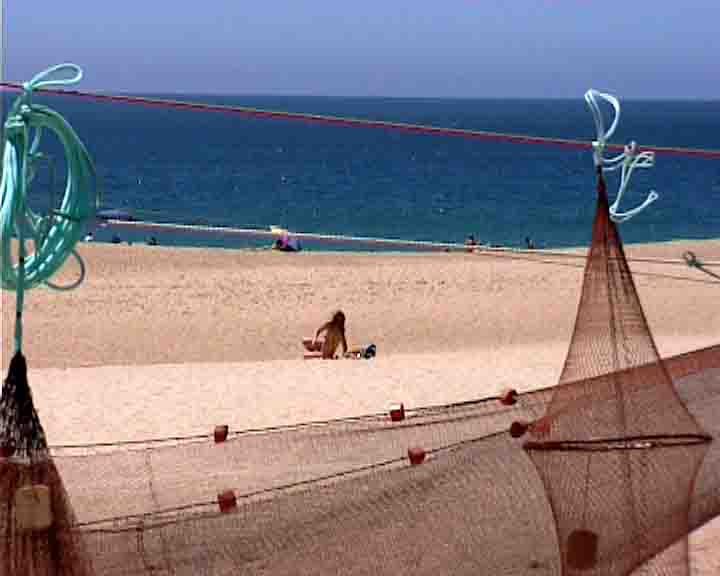 Fatima tours - Fishermen's nets mingle with bathers in a perfect harmony.