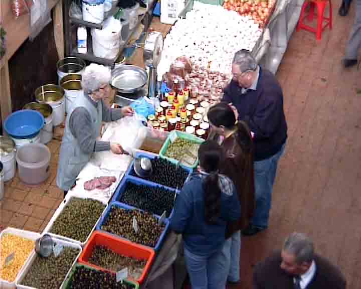 Look at this nice lady serving delicious olives...
