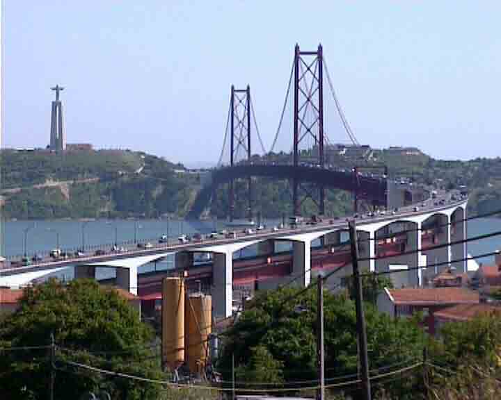 Portugal dvd video - The statue of Christ and the 25th of April bridge are two symbols of Lisbon.