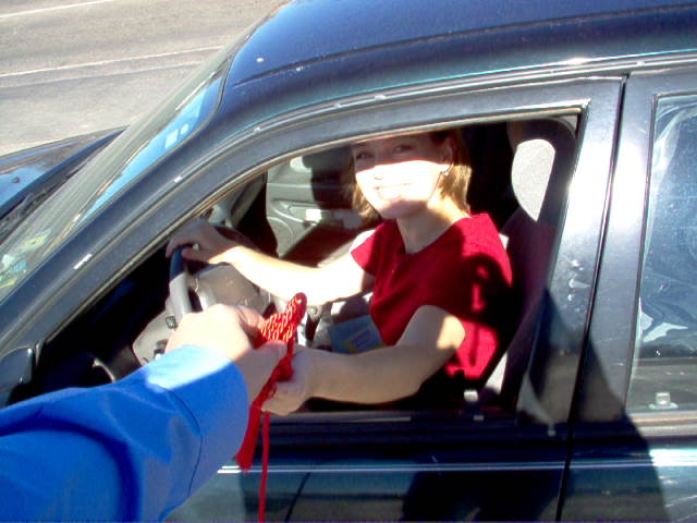 December - Graduated TTU on December 18, 2004. Here's a picture of Luke bringing my my red honor cords that I forgot!