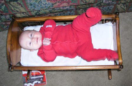 5 months- no longer fitting in the baby doll cradle