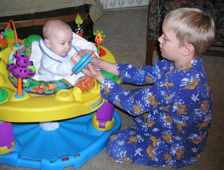 Jeffery shows Thomas some new toys