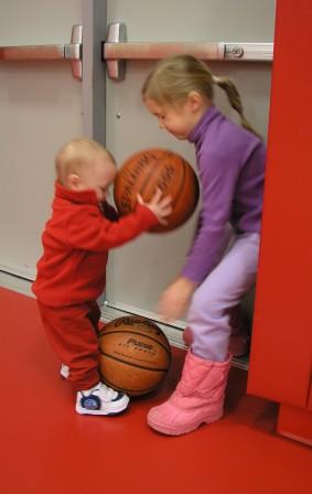 Bethan attemps to keep Thomas off the court