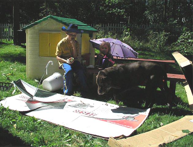 Morgan helps the kids play "ranch" in the backyard