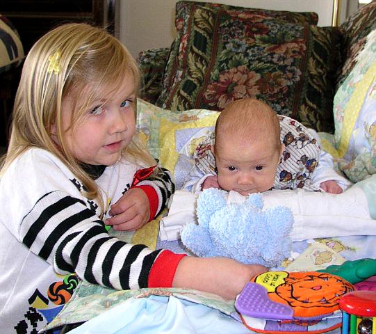 Bethan plays with Thomas during tummy time 