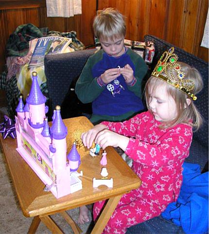 Bethan plays with her dream castle as Jeffery fixes the buggy