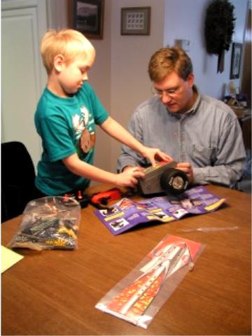 Working on the KNex race car from Aunt Lisa and family