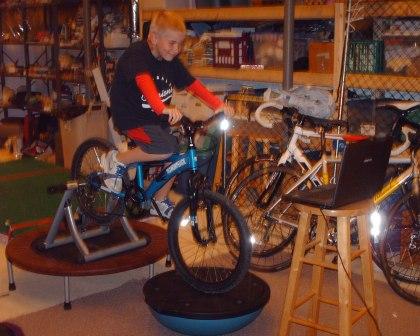 Eli enjoys "virtual mountain biking" thanks to Luke's invention