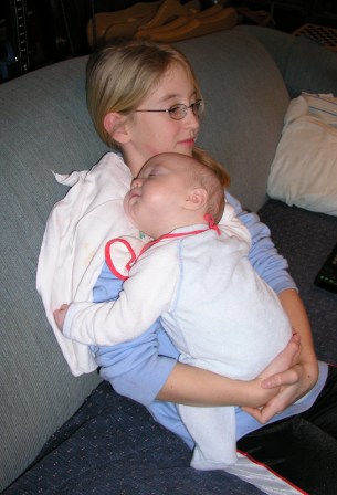 Thomas snuggles with Cousin Grace