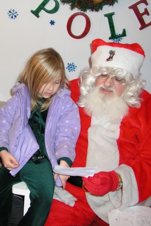 Santa and a horse drawn wagon ride