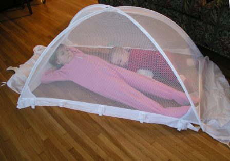 Bethan and Thomas check out the new crib tent (so Thomas won't climb out of his crib again!)