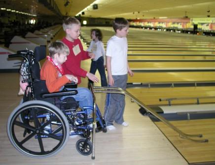 Jeffery helps his buddy bowl