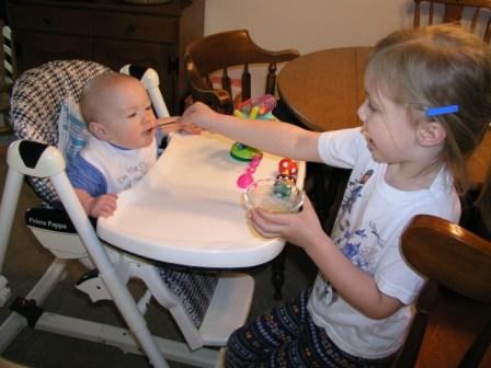 Bethan helps feed Thomas